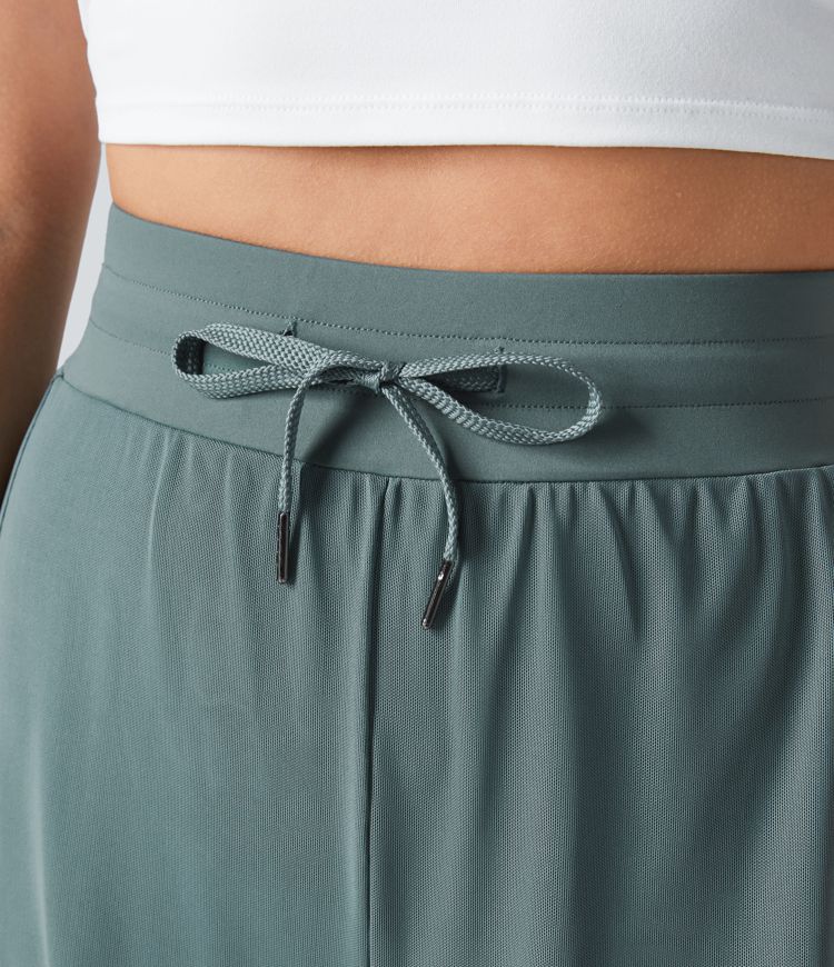 yogabroek met hoge taille trekkoord contrasterend mesh en 2-in-1 zakken wijde pijpen