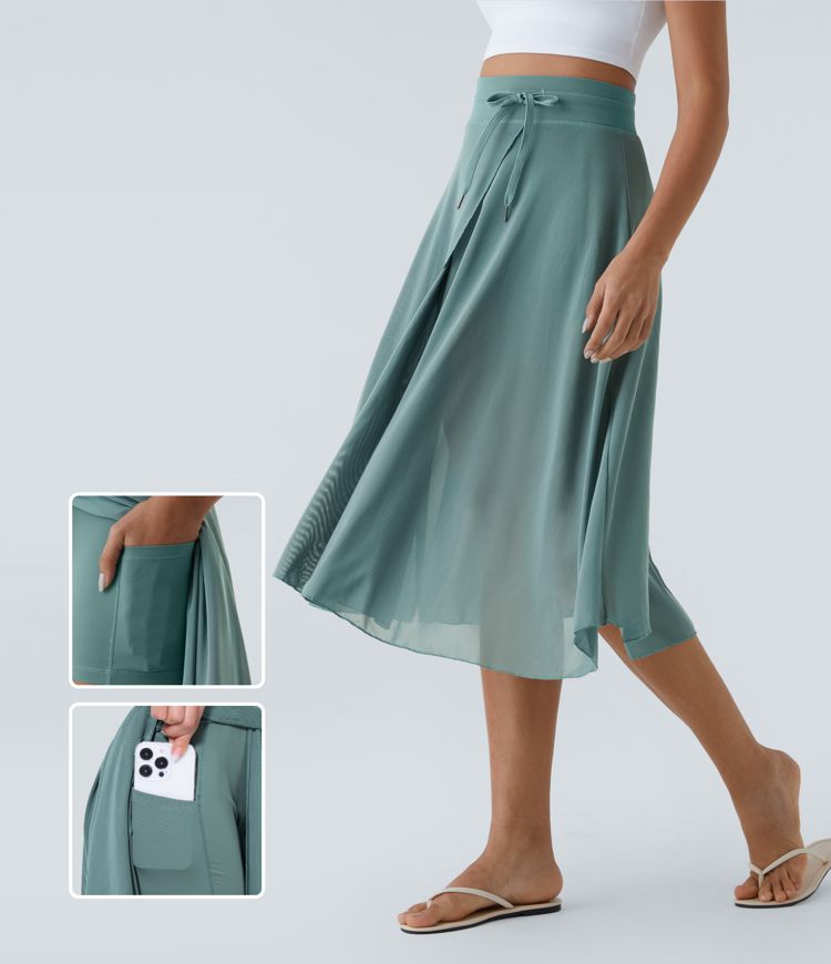 midi-rok met hoge taille trekkoord contrasterend mesh en 2-in-1 zakken zwierig model en wijdvallend model.