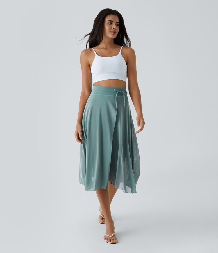 midi-rok met hoge taille trekkoord contrasterend mesh en 2-in-1 zakken zwierig model en wijdvallend model.