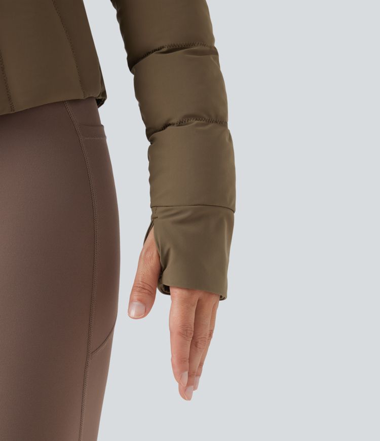 puffflex trainingsjas met opstaande kraag duimgaten elastische voering en zakken.